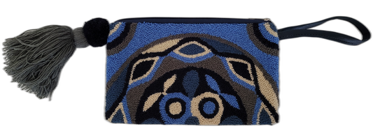 Boho chick clutch with geometric punch needle pattern and dark tassel

