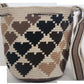 Neutral-toned bohemian Wayuu bag with tassels and shoulder strap