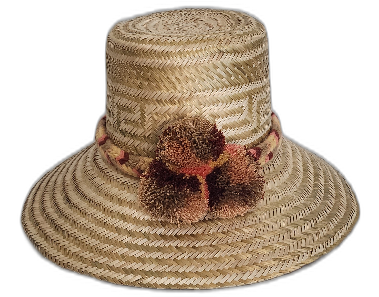 Boho straw hat with geometric pattern and artisan caramel-toned pompoms


