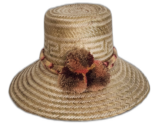 Boho straw hat with geometric pattern and artisan caramel-toned pompoms

