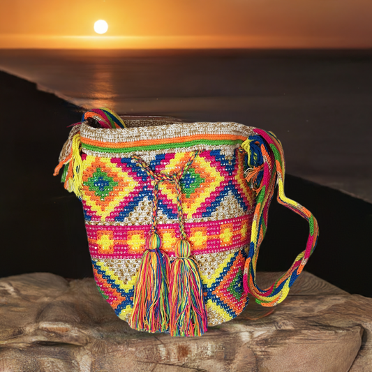 Handmade Wayuu crochet bag with rainbow tassels, crystals, and bright colors.