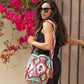 Unique boho Wayuu crossbody bag with vivid geometric strap and tassels