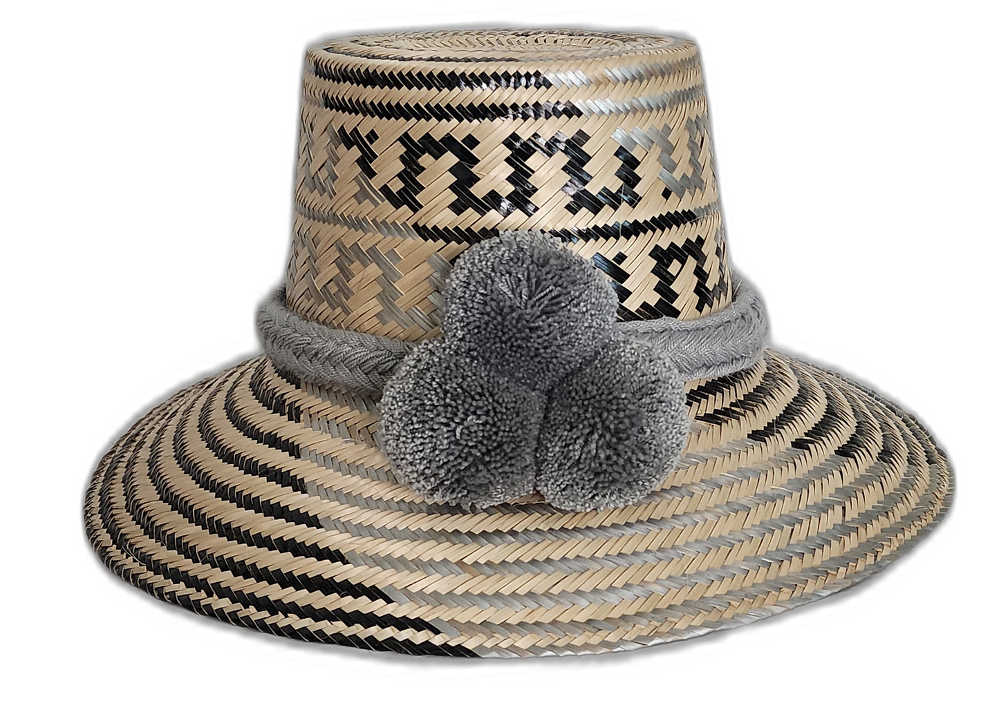 Handmade Wayuu straw hat in grey and black with matching grey pompoms.Bohemian artisan hat with soft gray pompom trio and handcrafted weave

