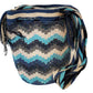 Ocean-inspired colorful Wayuu crochet bag with bold patterns and shimmer.