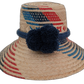Sage handmade Wayuu straw hat with red and navy geometric weave and navy pompoms

