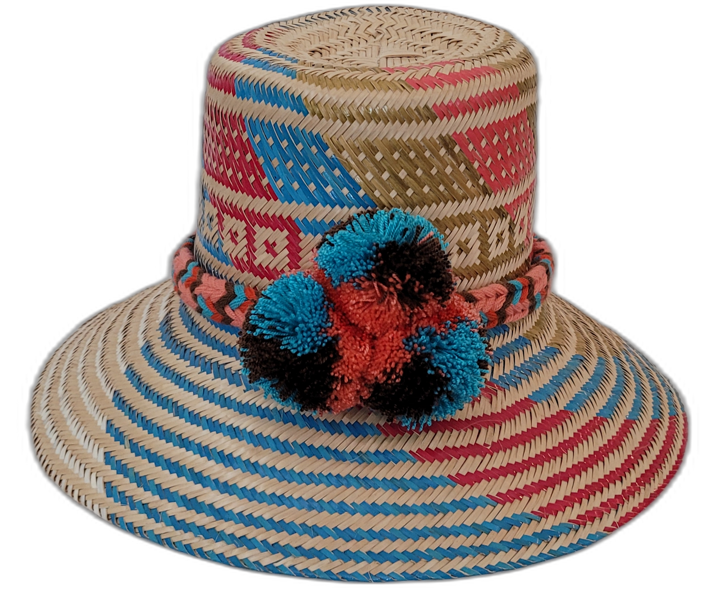 Selena handmade Wayuu hat with natural, red, blue, and black palm weave and pompoms

