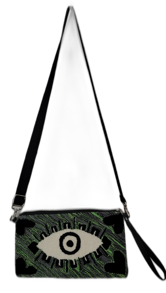 Bohemian clutch with green punch needle embroidery and bold eye design, crossbody style

