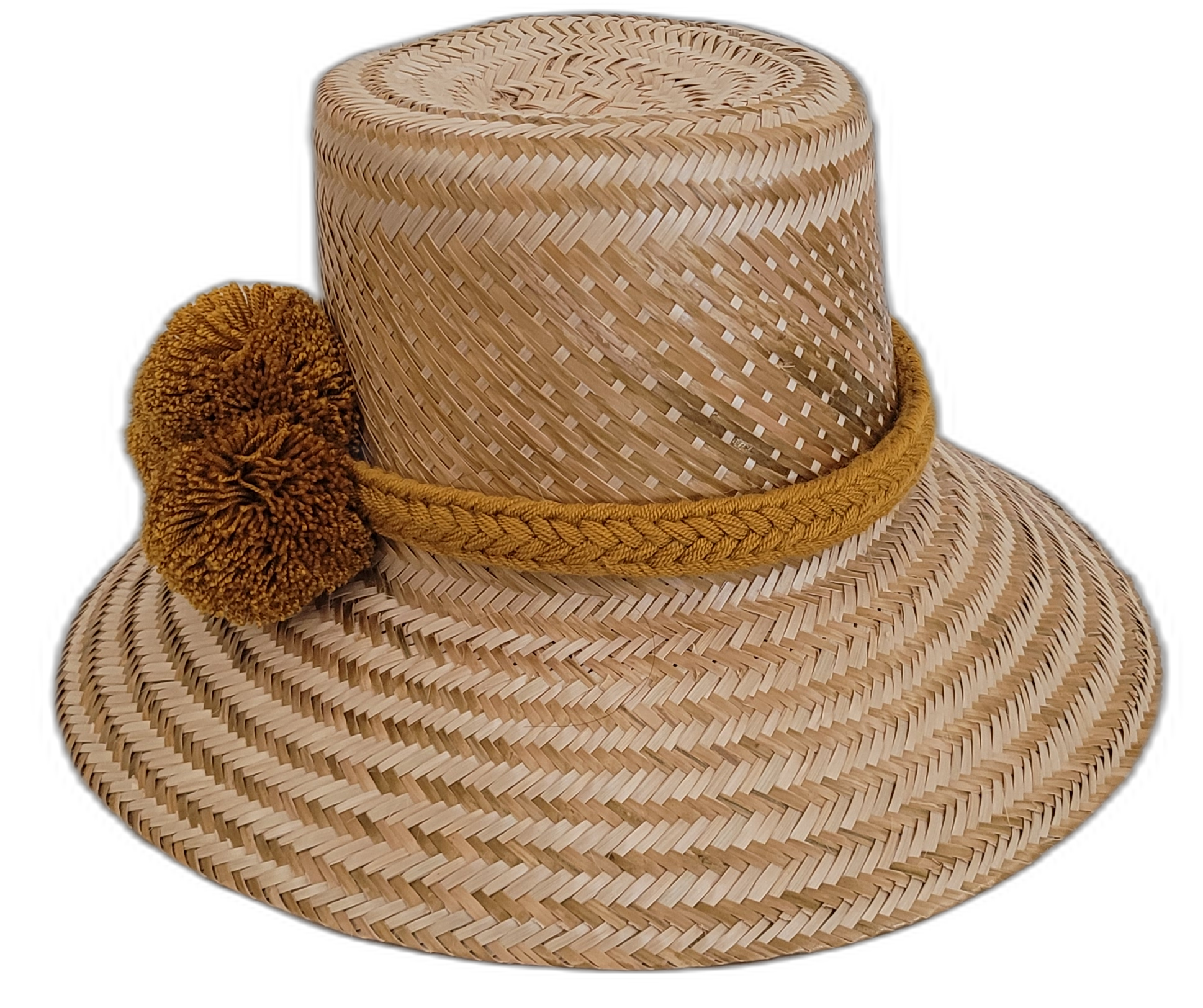 Artisan-crafted natural straw Wayuu hat with ochre pompom detail.


