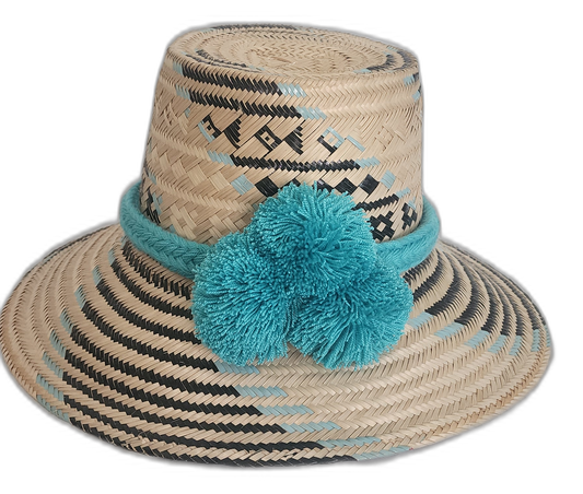 Handmade Wayuu straw hat with black and sky blue woven pattern and three light blue pompoms. Bohemian artisan hat featuring black and turquoise tribal patterns

