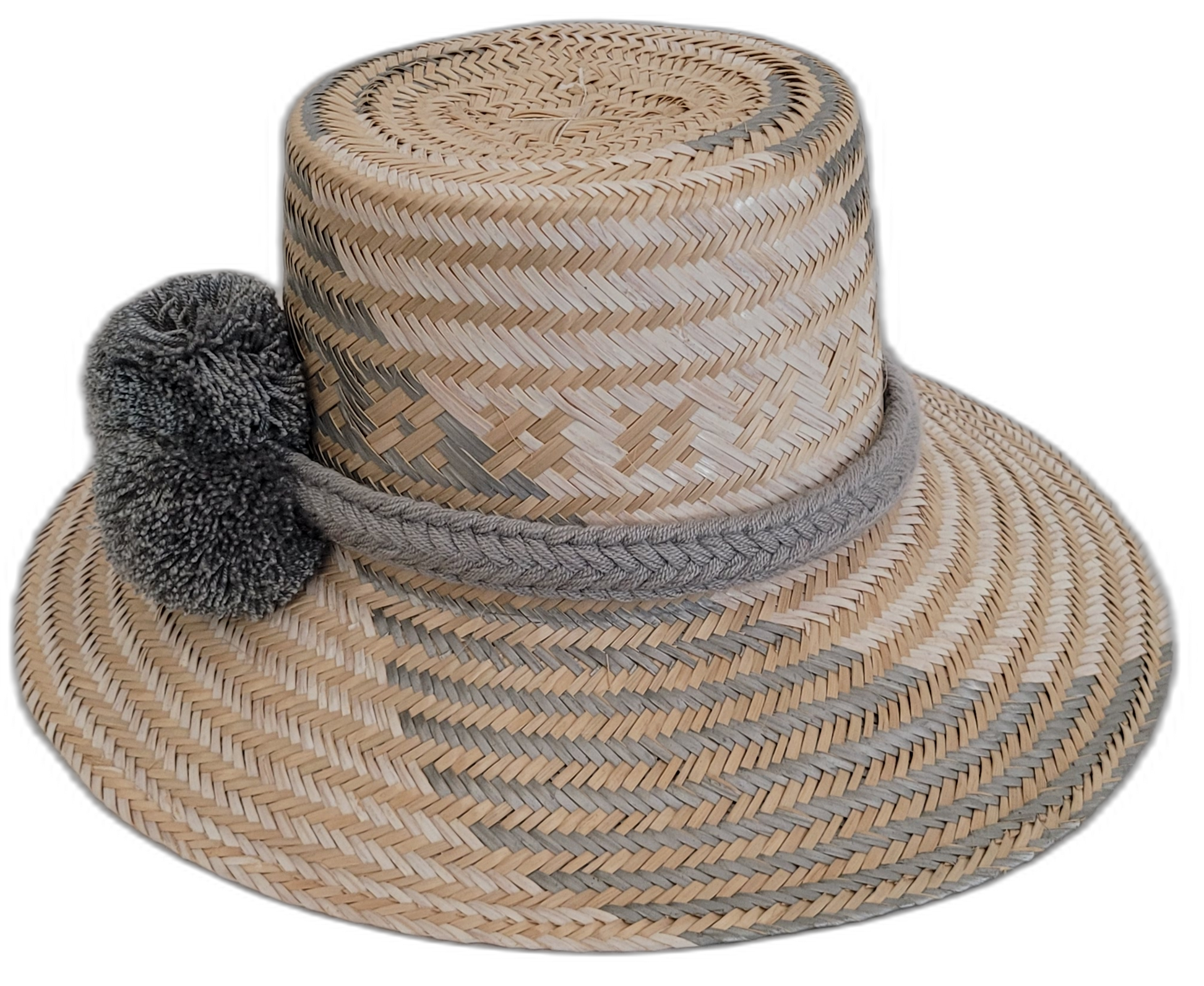 Artisan-crafted Wayuu straw hat in natural and gray, accented with gray pompoms.

