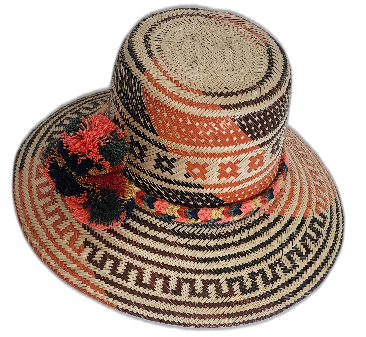 Artisan boho straw hat in natural straw with red and black patterns and colorful pompoms.

Wayuu hat with bold woven design and handcrafted green and red pompoms.