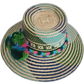 Bohemian chick hat with woven patterns and bold multicolor pompoms