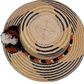Trinity Wayuu hat with handcrafted palm fiber and cultural pompoms in warm neutral tones

