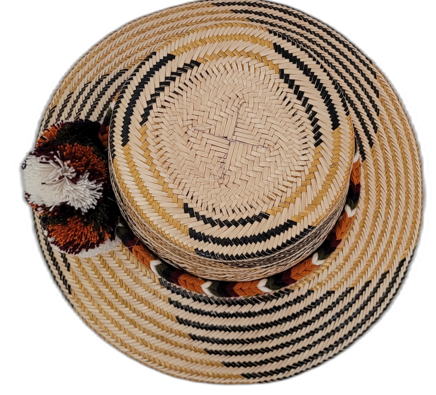 Trinity Wayuu hat with handcrafted palm fiber and cultural pompoms in warm neutral tones

