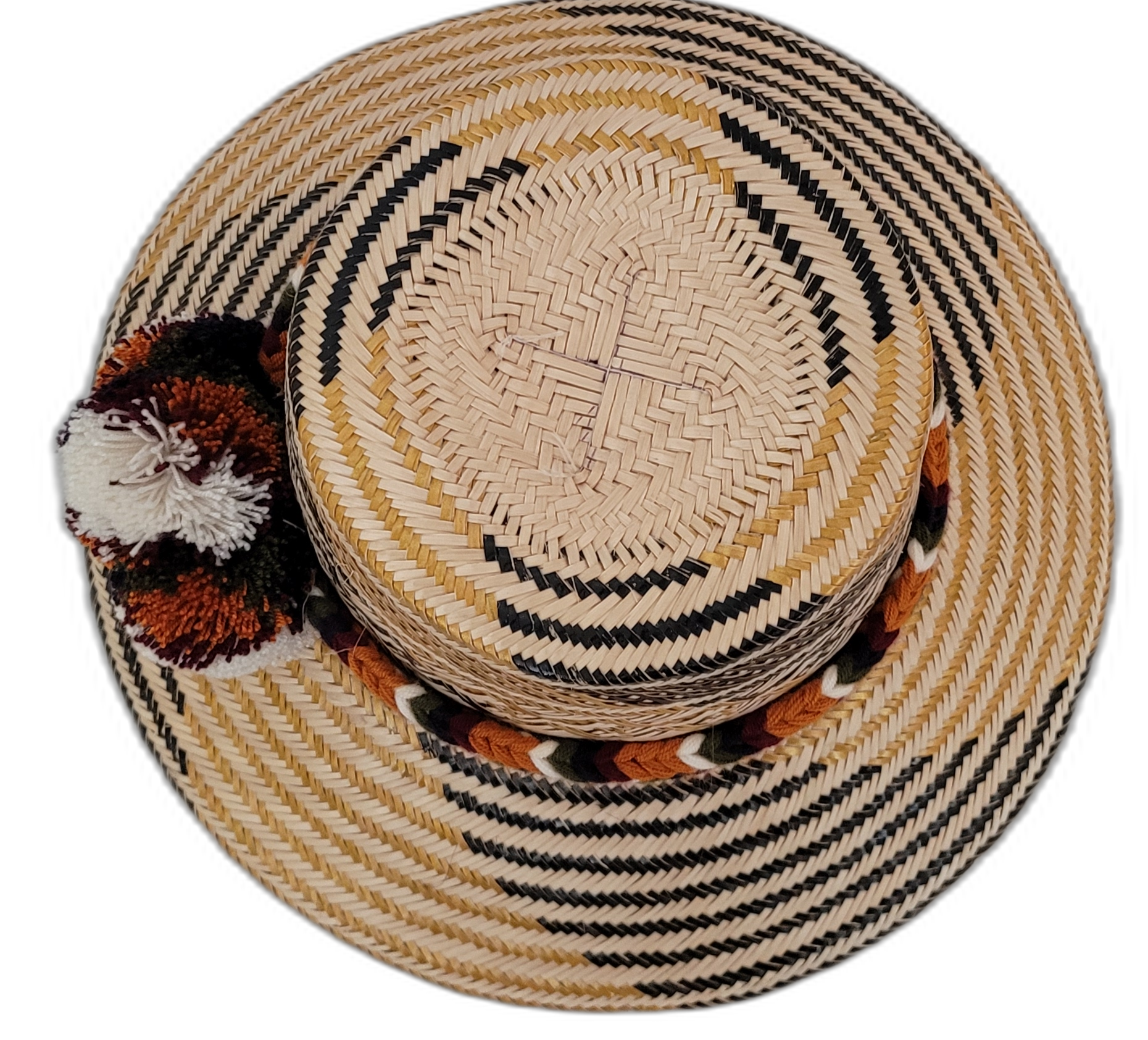 Trinity Wayuu hat with handcrafted palm fiber and cultural pompoms in warm neutral tones

