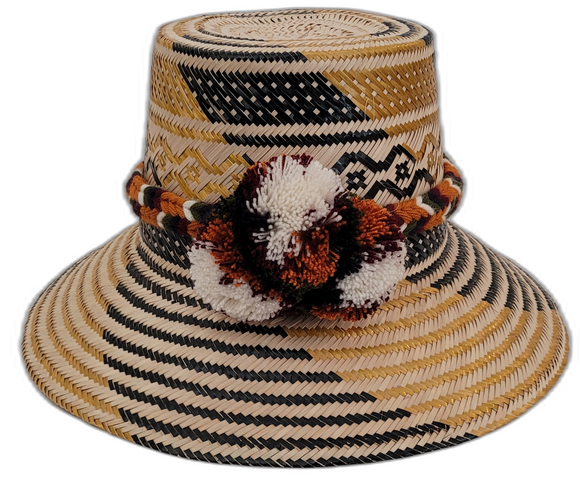 Trinity handmade Wayuu hat with black, natural, and mustard weave and earth-tone pompoms

