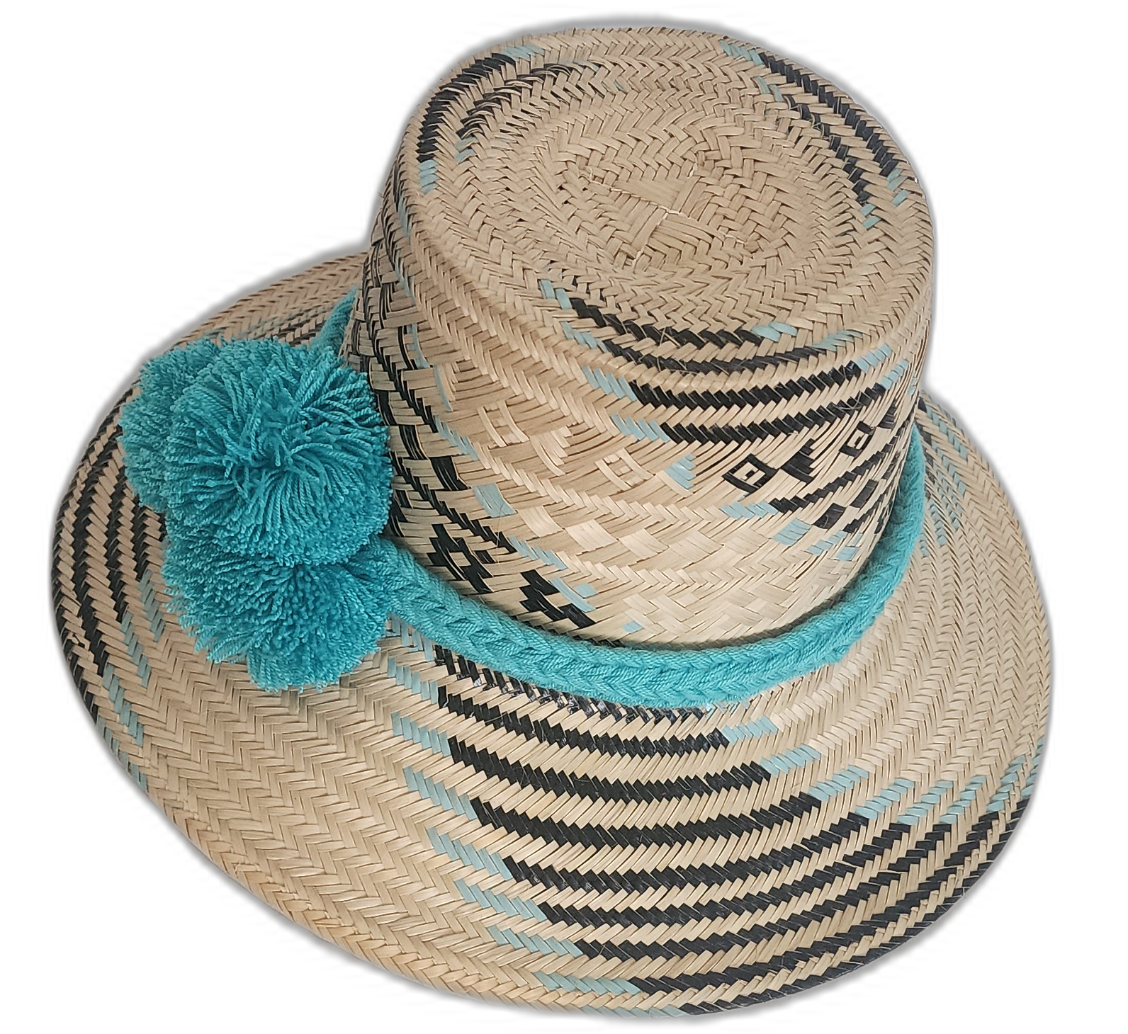 Artisan straw hat with bold symmetry and soft blue pompoms, woven from natural iraca palm fibers.

