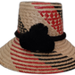 Vanessa handmade Wayuu straw hat in red and black with decorative black pompoms

