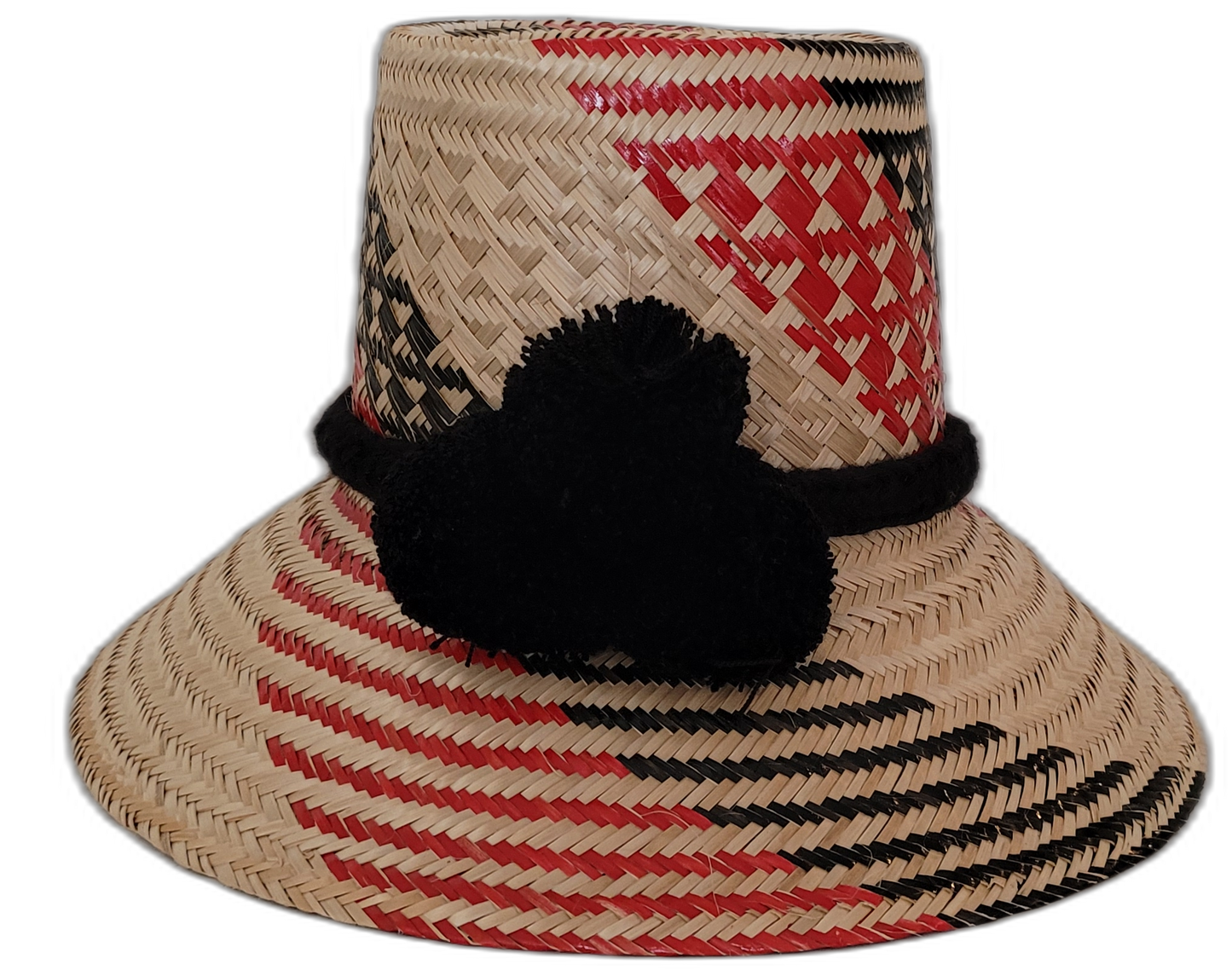 Vanessa handmade Wayuu straw hat in red and black with decorative black pompoms

