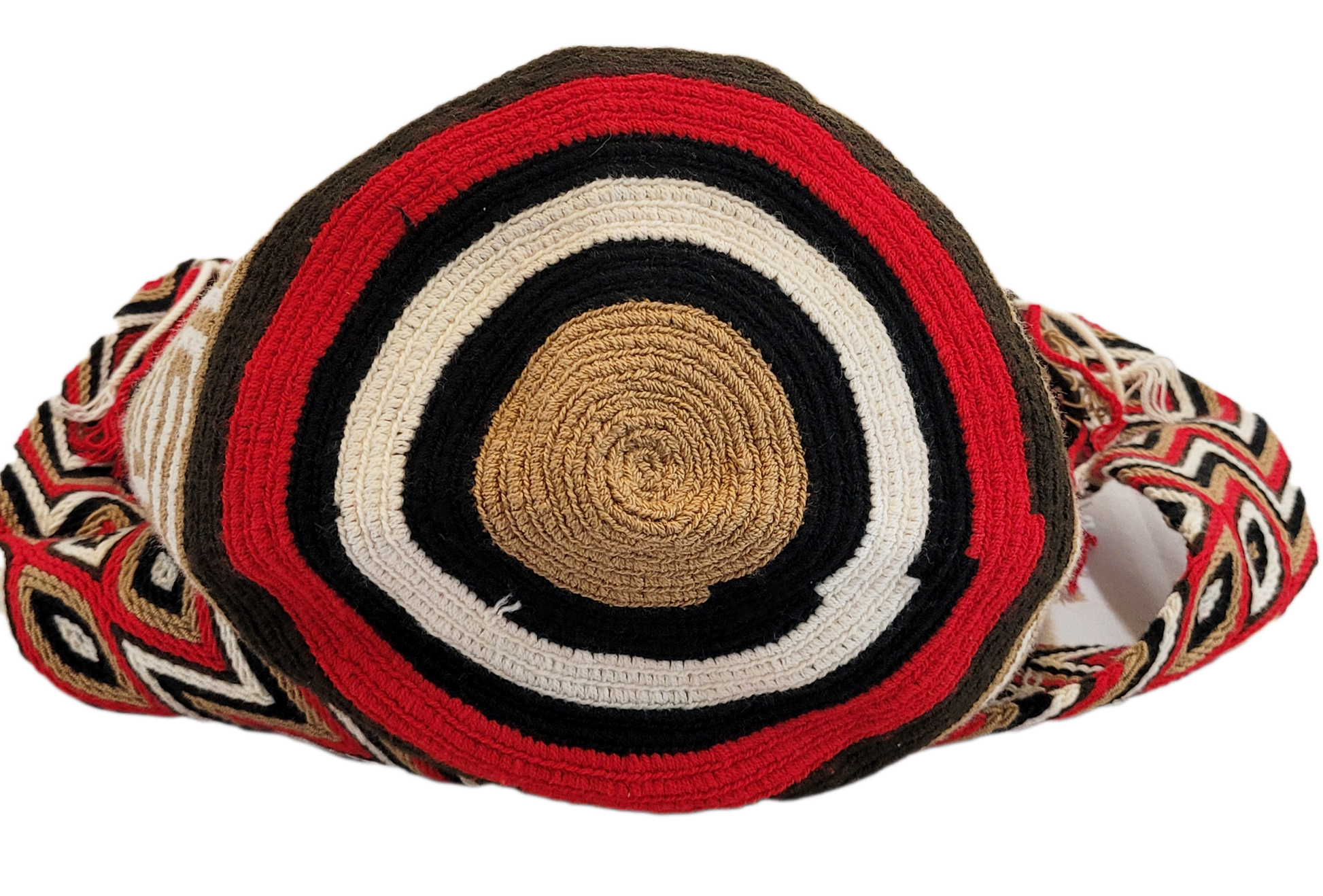 Vegan handmade Wayuu bag, black crochet design with red and tan accents, crossbody strap, and artisan tassels, perfect for boho chic fashion.