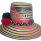 Boho straw hat with traditional Wayuu weave and a trio of vibrant pompoms.