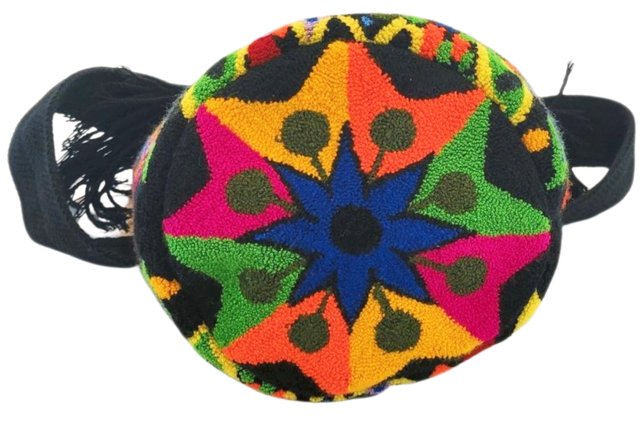 Vibrant boho Wayuu bag with punch-needle details and tassel accents