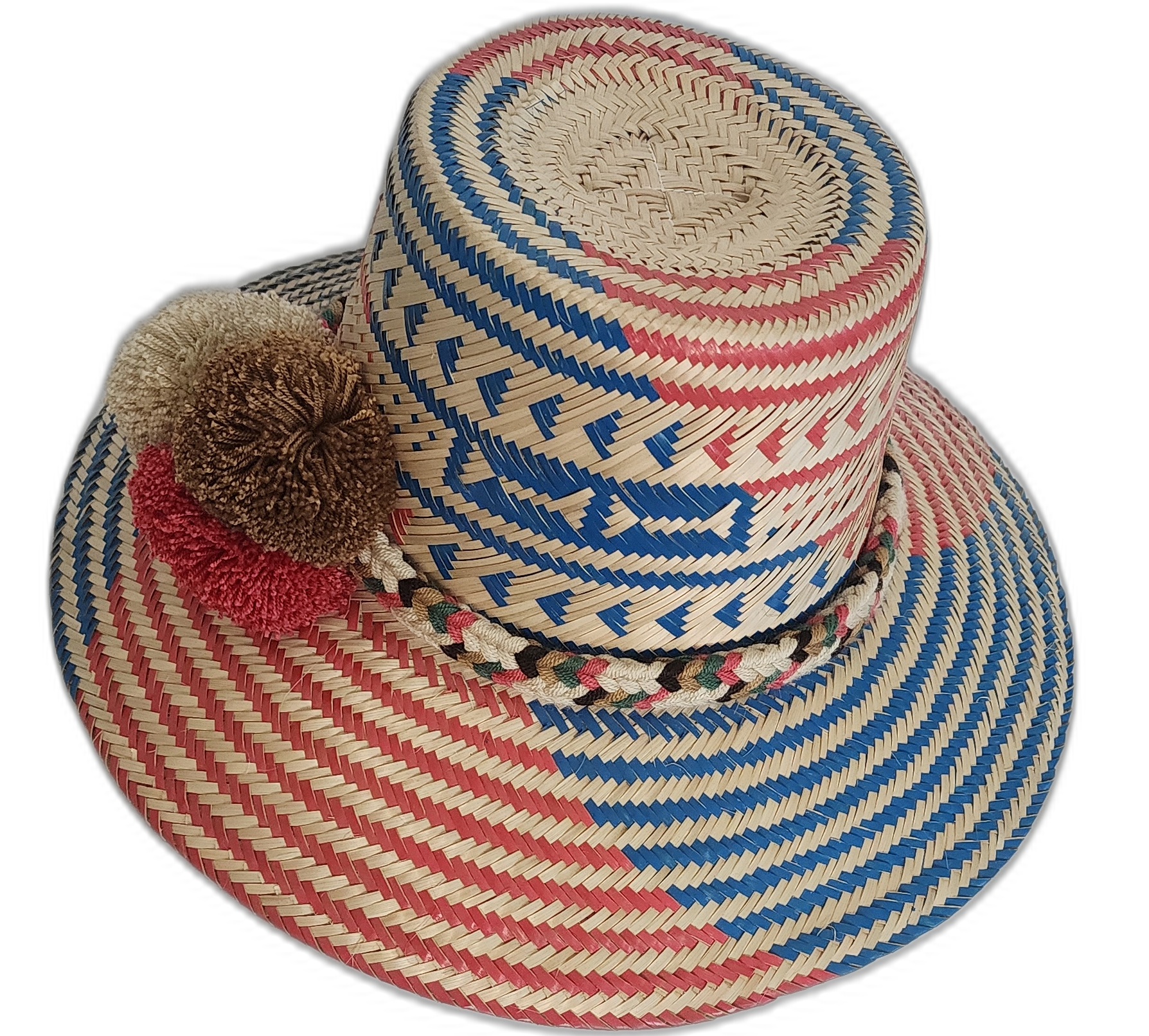 Artisan-crafted Wayuu hat featuring geometric weave and statement pompoms.