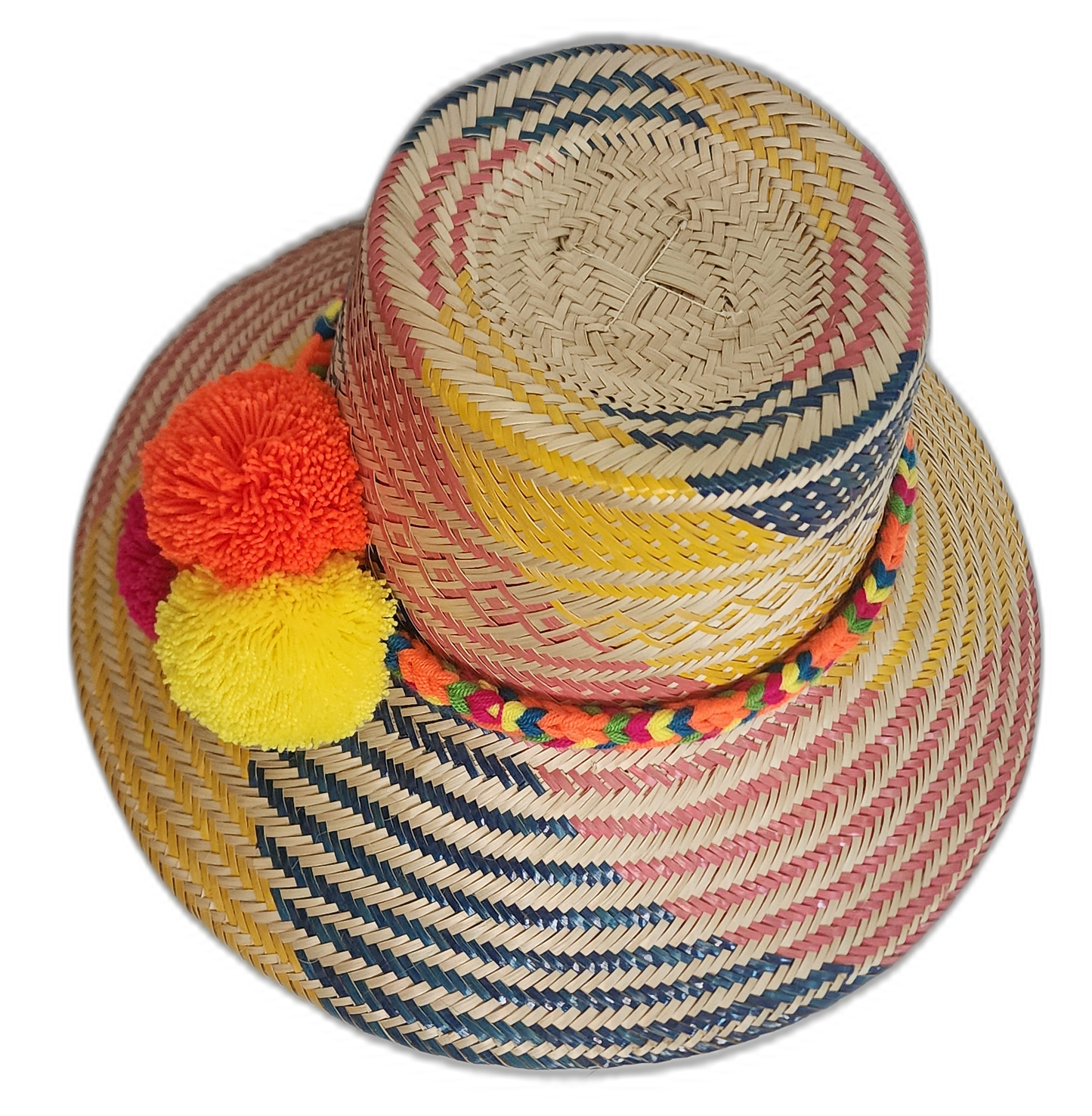 One-of-a-kind Wayuu straw hat with fuchsia, yellow, and orange pompoms on a bold pink-yellow design.