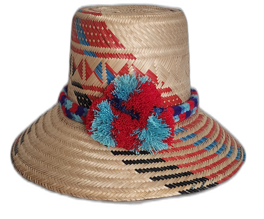 Handmade Wayuu straw hat with red and blue woven design and pompoms