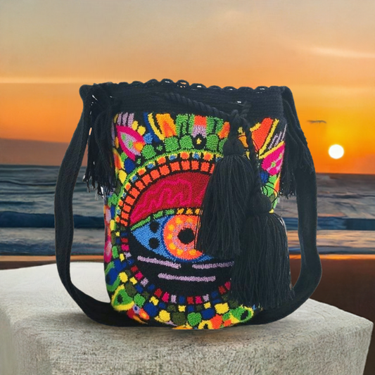 Handmade Wayuu crochet bag with boho eye design and vibrant embroidery