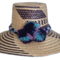 Handmade Wayuu straw hat with indigo, turquoise, and lilac pompoms
