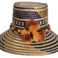 Handmade Wayuu straw hat with navy and gold tribal patterns and pompoms