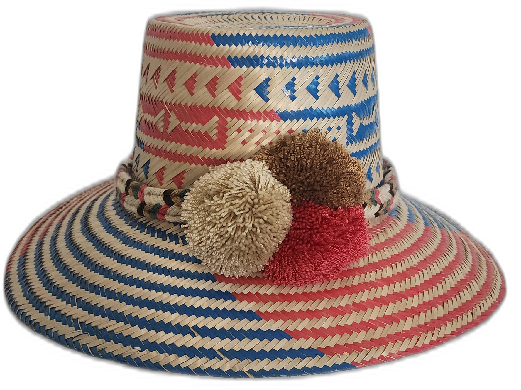 Handmade Wayuu straw hat with red and blue weave and ivory, brown, and red pompoms.