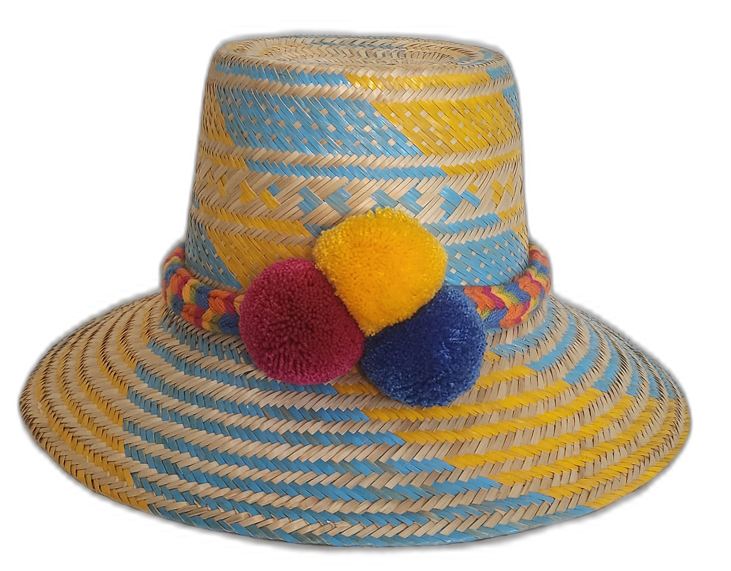 Colorful Wayuu handmade hat with blue and yellow straw weaving and vibrant red, yellow, and blue pompoms.