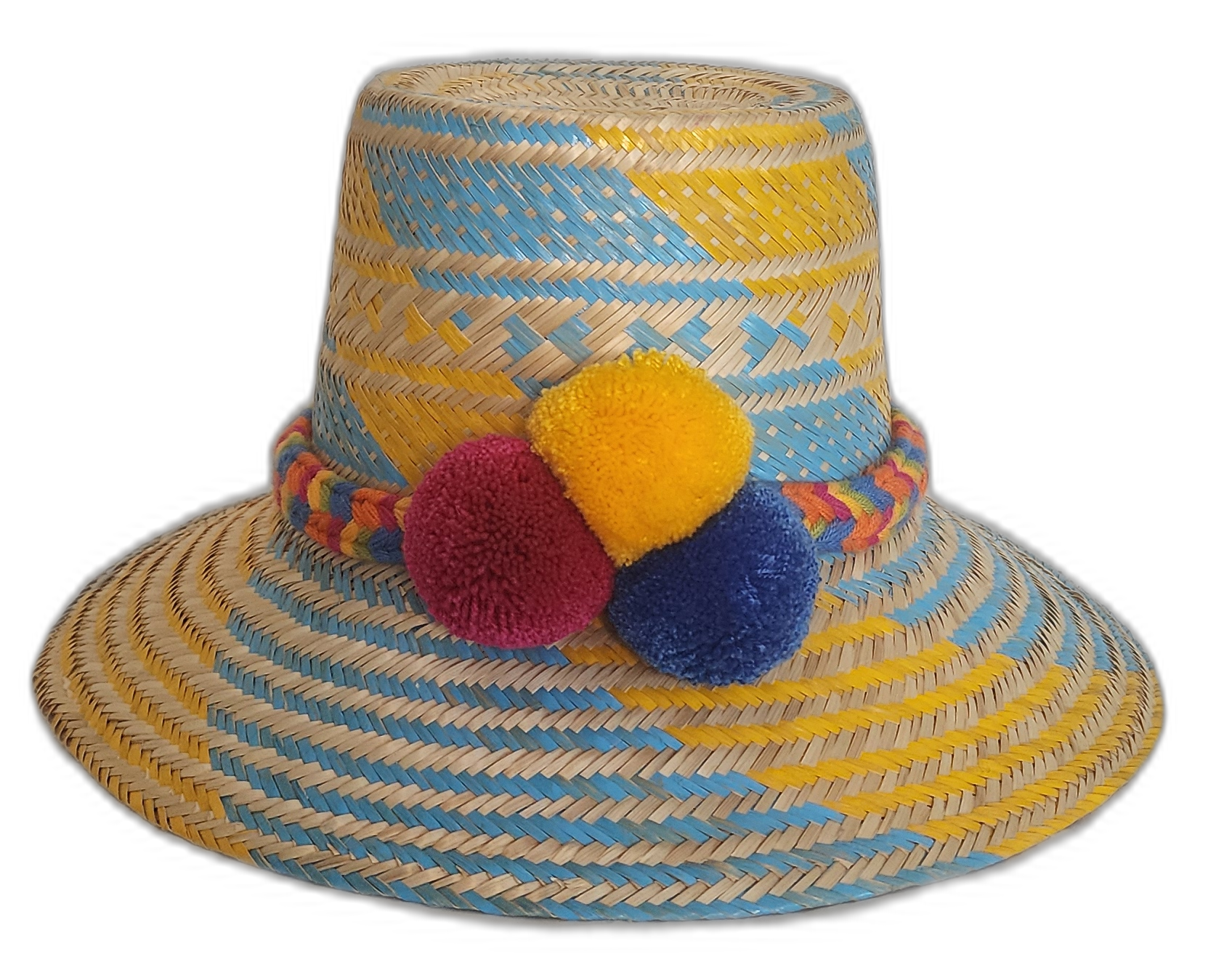 Colorful Wayuu handmade hat with blue and yellow straw weaving and vibrant red, yellow, and blue pompoms.