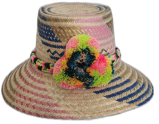 Handmade Wayuu straw hat with multicolor pompoms and pink-blue woven designs.