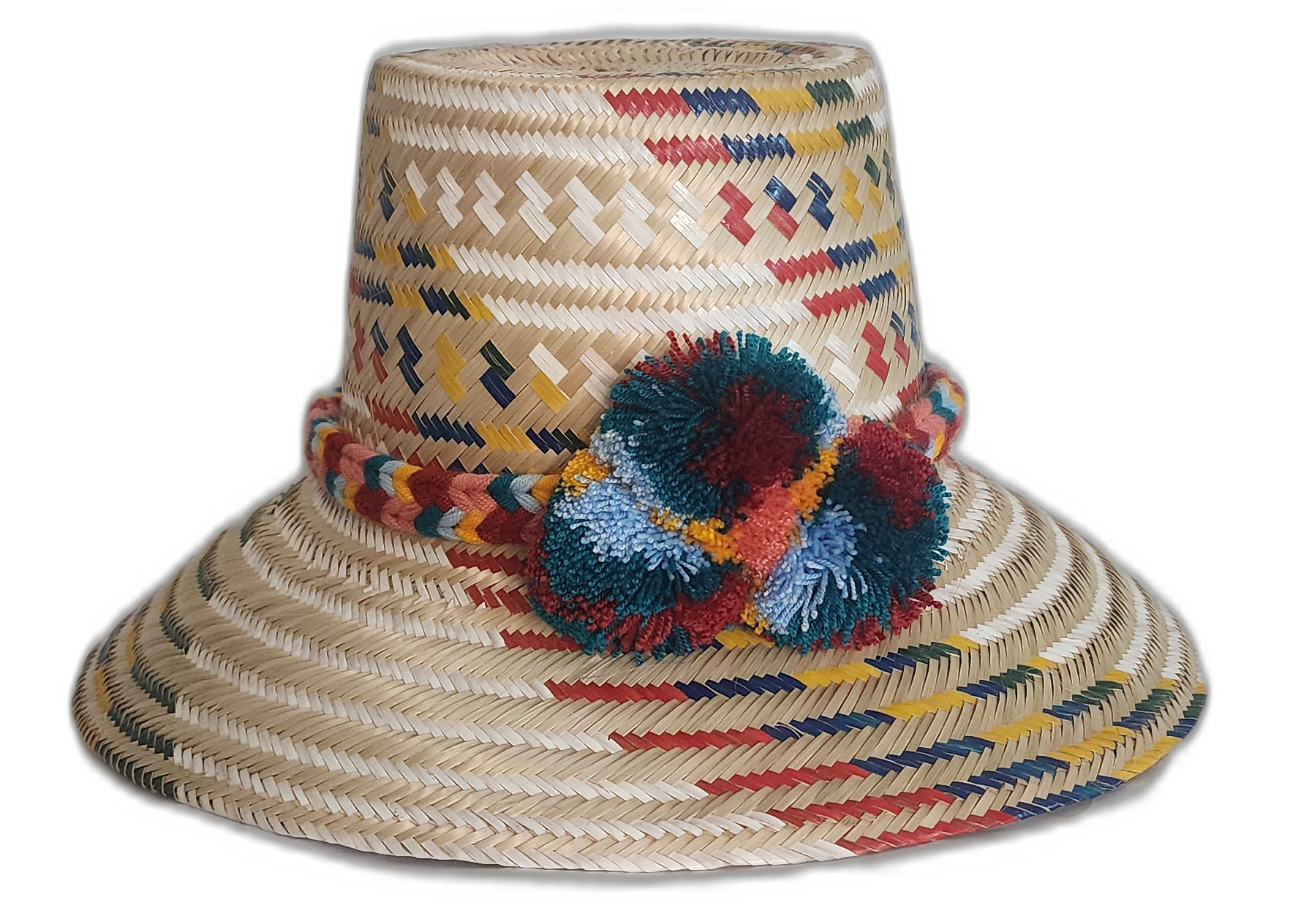 Handmade Wayuu straw hat with woven red, mustard, navy, and teal patterns and multicolor pompoms.