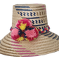 Designer straw hat handcrafted by Wayuu artisans from Iraca palm.
