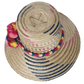 Designer straw hat handcrafted by Wayuu artisans from Iraca palm.
