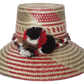 Stylish beach hat handcrafted by Wayuu artisans from Iraca palm.
