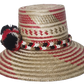 Stylish beach hat handcrafted by Wayuu artisans from Iraca palm.
