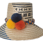 Summer straw hat handcrafted by Wayuu artisans from Iraca palm.
