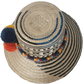 Summer straw hat handcrafted by Wayuu artisans from Iraca palm.

