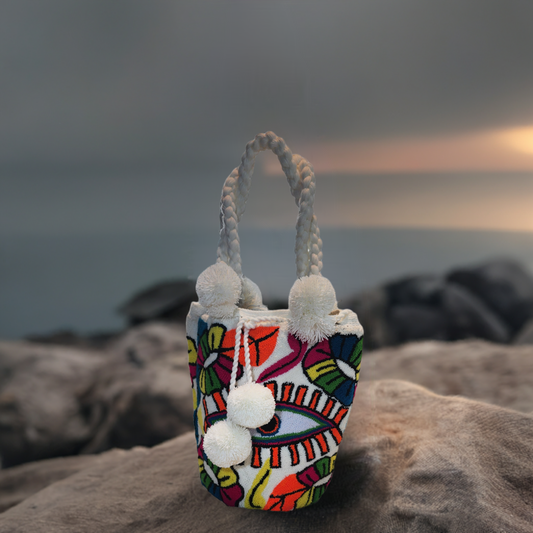 White-handled handmade punch needle Wayuu bag with floral pattern