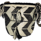Boho chick bag featuring monochrome zigzag patterns and tassel accents.