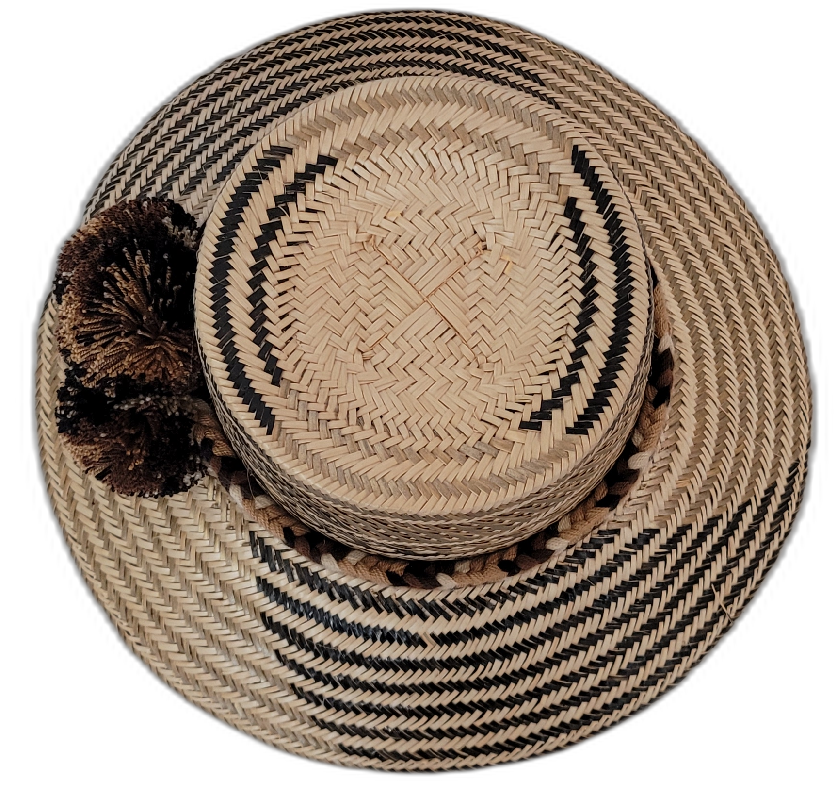 Artisan Wayuu hat Zuri crafted in earth tones with large brown and black pompoms

